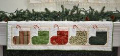 a quilted christmas stocking hanging on a wall