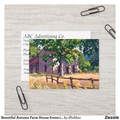 a postcard with a painting of an old farm house on it next to a pair of scissors