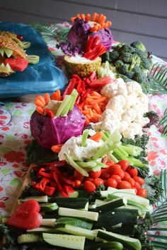 there are many different types of vegetables on the table together, including broccoli and cauliflower