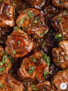 meatballs covered in sauce and garnished with parsley