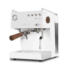 an espresso machine sitting on top of a white counter