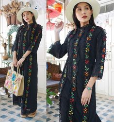 "Vintage Mexican hand embroidered dress in shade of black with colourful floral hand embroidered. Tailored with half puff sleeves and lace trim. Cotton material. Dress zips up the back. Measurements (Inch) size estimate: M *Measurements are taken in inches with the garment laying flat. BUST: 38 \" WAIST: 34 \" HIPS: 40 \" FULL LENGTH: 56 \" SLEEVES LENGTH : 18 \" Condition: In very good vintage condition. *If you are not sure about size please feel free to contact me I would be happy to help all Traditional Black Dress With Chikankari Embroidery, Black Folk Style Dress For Festivals, Black Bohemian Dress With Intricate Embroidery, Black Dress With Resham Embroidery For Summer, Folk Style Black Dress For Festivals, Black Summer Dress With Resham Embroidery, Black Dresses With Intricate Embroidery For Traditional Ceremonies, Black Bohemian Dress With Embroidered Sleeves, Traditional Black Embroidered Dress