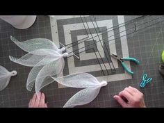 someone is making something out of mesh and scissors