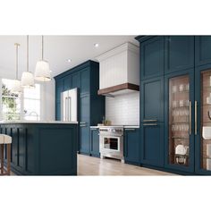 a kitchen with blue cabinets and white counter tops is shown in this image, there are three hanging lights above the stove