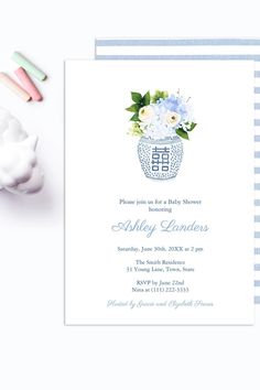 a blue and white striped baby shower with flowers