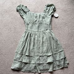 Size Medium Brand New With Tags Hollister Saidie On Off Shoulder Tiered Sundress Dress Skort Sage Green Ruffle Green Fitted Tiered Mini Dress, Fitted Green Tiered Mini Dress, Knee-length Ruched Sundress For Spring, Fitted Tiered Mini Dress For Daywear, Casual Knee-length Lined Midi Dress, Casual Lined Knee-length Midi Dress, Casual Tiered Lined Dress, Casual Lined Tiered Dresses, Casual Lined Midi Dress