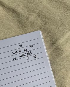 a notepad with the words we'll be alright written in cursive writing