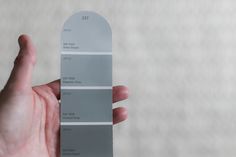 a hand holding a gray color swat list