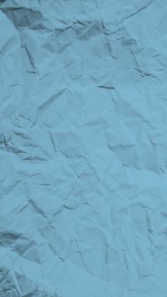 a piece of paper that is blue and wrinkled