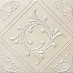 a white ceiling tile with an ornate design