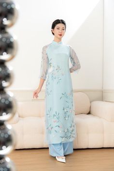 Elegant and sophisicated light blue floral ao dai set made with premium organza material pairing with white pants. Luxury Blue Ao Dai For Evening, Luxury Blue Ao Dai For Festive Occasions, Luxury Blue Long Sleeve Ao Dai, Luxury Blue Long-sleeve Ao Dai, Luxury Blue Ao Dai For Festive Season, Ao Dai White, Wedding Ao Dai, Ao Dai Vietnamese, Organza Material