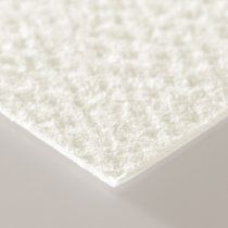 a close up view of a white surface