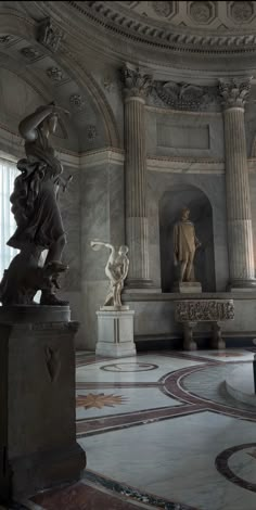 a statue in the middle of a large room