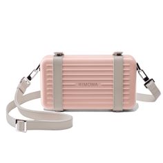 Pre-order from 11/19 Made in Germany and crafted in ultra-lightweight, dent-resistant grooved polycarbonate, the RIMOWA Personal in Desert Rose Pink is a unisex hard-shell crossbody bag meant to house and transport your daily personal essentials. It can be worn with the detachable, adjustable leather body strap or carried like a clutch. Each detail of the RIMOWA Personal in Desert Rose Pink is carefully considered from its color-matched straps and leather lining down to its metal rivets, rings, Trendy Rectangular Travel Box Bag, Chic Portable Box Bag For Travel, Rectangular Travel Shoulder Bag, Chic Portable Shoulder Bag For Travel, Modern Portable Rectangular Shoulder Bag, Trendy Rectangular Case Bag For On-the-go, Chic Portable Bag For Travel, Chic Portable Travel Bags, Modern Portable Bag For On-the-go