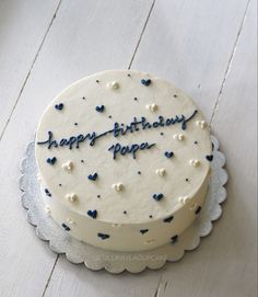 a birthday cake with blue and white sprinkles