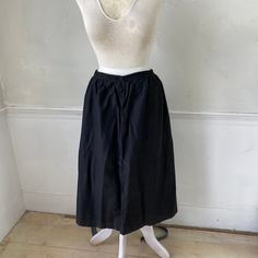 Hello and welcome to the Textile Trunk! Please follow us on Instagram, we are @textiletrunk This gorgeous textile is French and dates from somewhere between 1910 and 1930. This skirt is lovely and soft, and has a sateen weave. It closes at the waist with a hook and eye (of which there are two for size adjustability!). There is some hand mending along the waistband (see condition notes), and there are some lovely gathers which make this a wonderful somewhat full skirt.~ GORGEOUS! Ideal for wearin Black Cotton Bottoms With Gathered Skirt, Black Full Skirt Bottoms For Daywear, Black Daywear Lined Skirt, Black Lined Skirt For Daywear, Vintage Skirt With Elastic Waistband, Vintage Black Pleated Skirt, Black Vintage Pleated Skirt, Vintage Black Lined Skirt, Traditional Long Black Skirt