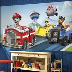 the wall mural in this children's room is painted with paw patrol and firetrucks