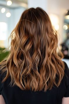 Medium brown hair with honey blonde balayage, creating a natural and sun-kissed look Honey Blonde Balayage