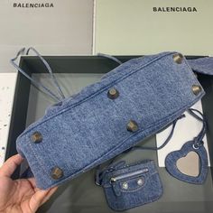 Description Balen Le Cagole XS Shoulder Bag In Blue Washed, For Women, Bags 13in/33cm Rep 1:1 Size: 33 x 16 x 8.4 cm /13 x 6.3 x 3.3 inches (Lenght x Height x Width) Shoulder bag Adjustable shoulder strap Braided shoulder pad Zipped closure with knotted puller 1 removable zipped pouch 1 removable heart mirror Includes dust bag. This product is of the best quality. Designer Blue Satchel With Large Capacity, Designer Blue Bag With Double Handle, Luxury Blue Bucket Bag With Top Carry Handle, Travel Baguette Bag With Branded Hardware Satchel, Shopping Satchel Baguette Bag With Branded Hardware, Designer Blue Bag With Top Carry Handle, Designer Blue Handheld Satchel, Trendy Blue Top Handle Baguette Bag, Designer Blue Bags For Everyday Use