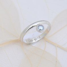 A delicate silver ring made of silver in an ice matt look with a set pearl. A very special piece of jewelry. All jewelry will be packed in a pretty colorful organza bag for you. It's a nice gift for friends or yourself! Delicate Silver Rings, Ring Pearl, Simple Ring, Rings Simple, Silver Pearls, Organza Bags, Pearl Ring, Rings Statement, Statement Rings