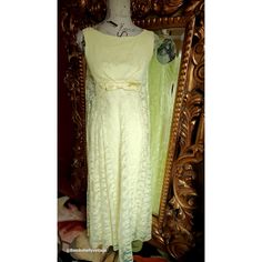 This sunny beauty of a gown is from the 60's. Excellent condition. The under dress is made of a yellow rayon crepe with center back metal zipper. Classic sheath shape. The outer layer is made of a soft floral yellow lace. Nipped in the front with a satin belt with bow detail. The back hangs free from the shoulders. You literally look like you are floating across the room in the gown.  Best fit would be a Small, however, please see the measurements below for a proper fit.  All sales are final. Measurements Armpit-armpit doubled 34" Waist 26" Hip 36" Length 53" Yellow Vintage Dress For Vintage Events, Yellow Retro Dress For Formal Occasions, Yellow Retro Formal Dress, Retro Yellow Wedding Dress, Elegant Yellow Vintage Dress, Vintage Yellow Formal Dress, Yellow Retro Evening Dress, Elegant Yellow Vintage Dress For Spring, Satin Belt