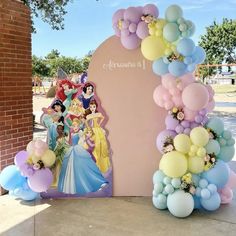 there are balloons and princesses on the side of this arch for a birthday party