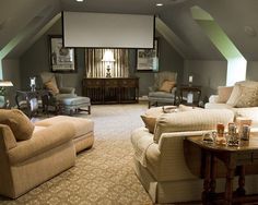 a living room filled with furniture and a flat screen tv mounted to the wall above it