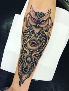 an owl and demon tattoo on the left arm is shown in black and grey colors