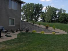 an outdoor patio with steps leading up to the house