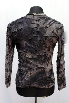 "A long sleeve t-shirt for the post apocalyptic walking undead. A long sleeve t-shirt with a slim fit made in a lightweight double-layered stretch fabric. The top layer is shredded and distressed grey black bleached out fabric with the underlying bleached black fabric showing through. Super creepy!! Comes in sizes Small-XXL. Size measurements: Small = Chest 36\" Waist 30\" Medium = Chest 40\" Waist 35\" Large = Chest 43\" Waist 37\" XL = Chest 46\" Waist 39\" XXL = Chest 48\" Waist 43\"" Mens Vests, Men's Long Sleeve T-shirt, Sleeveless Hoodie, Mens Long Sleeve Tee, Post Apocalyptic, Small Chest, Black Fabric, Mens Coats, Mens Long Sleeve