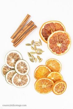 orange slices, cinnamon sticks and star anise on a white background