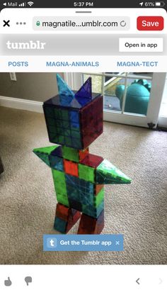 an image of a toy made out of rubikt cubes on the floor