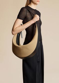 The Augustina Hobo in Honey Canvas with Black Leather– KHAITE Black Honey, Iconic Bags, Leather Care, Tan Leather, Calf Leather, Carry On, Honey, Black Leather, Canvas