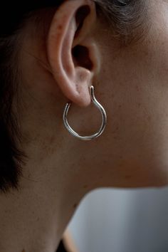 Modern pair of sterling silver minimalist stud hoop earrings with organic shape. You can find these open hoop earrings also in gold plated brass or solid gold. These delicate clean lines hoop earrings are exactly the modern and edgy hoops you need to have.It's raw texture highlights the craftsmanship that was used to make the earrings, and makes it more unique then the generic hoop earrings. ✔ Nickel Free✔ Packed in a labeled gift box✔ Hand made with love in Tel Aviv✔ 14 days return policy, star Modern Gold Earrings, Raw Texture, Silver Pinky Ring, Gold Nose Hoop, Pinky Signet Ring, Indian Nose Ring, Silver Nose Ring, Septum Jewelry, Open Hoop Earrings