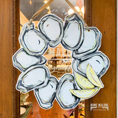 a glass plate with some bananas on it in front of a storefront door window