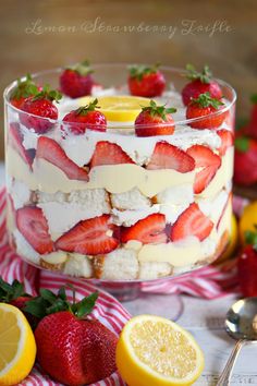 a layered cake with strawberries and lemons