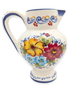 a white and blue vase with flowers painted on it