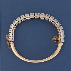 A current fave! I love me some pieces which had been re-imagined from others, or may be converted/worn any other way. This Victorian bracelet is the perfect example - it's believed to have come from a tiara or another bracelet (how cool is that?). See how the diamond section fully detaches from the bottom? Methinks we can create a custom headband (can send you ideas) so that you get double use for this jewel! This piece, given its age and uniqueness, really make it very very special! 18kt yellow 17 Jewels Bangle Diamond Bracelet For Anniversary, Formal Bangle Bracelet With Rose Cut Diamonds, Heirloom Diamond Jubilee Bracelet For Wedding, Heirloom Jubilee Diamond Bracelet For Wedding, Vintage Bangle Bracelet With Single Cut Diamonds, Formal Rose Cut Diamond Bangle Bracelet, Rose Cut Diamond Bangle For Anniversary, Anniversary Rose Cut Diamond Bangle Bracelet, Diamond Bangle Bracelet With Rose Cut Diamonds