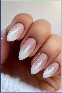 These delicate frosted nails with white details bring the perfect winter wonderland vibe! Whether you're keeping it casual or dressing up, this winter nail design adds just the right amount of charm. Visit nailhow.com for more winter nail colors and ideas and save this pin for your next manicure! Oval Pink And White Nails, White Festive Nails, Gel Nails Winter Colors, Winter Nails Round Shape, Almond Nails Christmas Designs Simple, Nail Ideas Winter Colors, Winter Nails Round, Nails Winter White, Winter Nail Designs Short