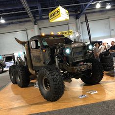 an army truck is on display in a showroom