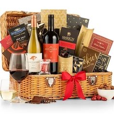 a wine gift basket with two bottles of wine and grapes