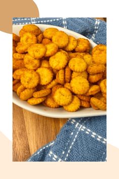 a white plate filled with tater tots on top of a blue and white towel