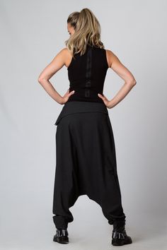 "Harem Pants Women, Black Pants, Drop Crotch Pants This is one of my favorite women's extravagant boho trousers - super comfy drop-crotch lose cut wide-leg tapered at the bottom maxi harem pants. I adore those loose, casual long pants! Handmade from 100% high-quality, excellent cool wool, these pants are an excellent winter, spring, and fall clothing option. KEY FEATURES: - Drop crotch, super loose - Tapered legs - Hidden zipper closure at the hip - Custom size and plus size available at NO EXTR Loosely Fitted Harem Pants For Fall, Bohemian Black Pants, Baggy Harem Bottoms For Fall, Summer Wide Leg Pants For Alternative Fashion, Loosely Fitted Harem Bottoms For Fall, Fitted Black Lagenlook Bottoms, Baggy Bohemian Bottoms For Fall, Stretch Harem Pants For Festivals, Black Stretch Harem Bottoms