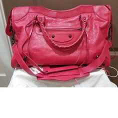 Genuine With Dust Bag Balenciaga Classic City Bag Hot Pink With Copper Hardware Very Gently Used Few Times Only, Picture Shows Natural Wear Of Lamb Skin. Elsewhere Is Perfect. No Defect L14.5x H9.5x W5.5 Inches Top Zip Closure Optional Shoulder Strap Optional Mirror Interior Zip, Wall And Smartphone Pockets Lambskin Leather Made In Italy Pink Belenciaga Bag, Pink Balenciga Bag, Balenciaga Le Cagole Pink Rhinestone, Balenciaga Classic City Bag, Bags Balenciaga, Balenciaga Classic City, Only Picture, Copper Hardware, Mirror Interior