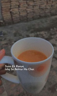 a person holding a cup of coffee in their hand with the words suno e k ra rays, ish se behter ha cha