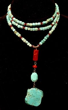 This beautiful necklace was made with square turquoise and round carnelian beads. The charm is also turquoise and carnelian and really pulls the red beautiful from the necklace. Turquoise is said to help the wearer live a life of integrity and to bring balance to our feminine or masculine traits. Bohemian Style Adjustable Necklace With Square Pendant, Bohemian Adjustable Necklace With Square Pendant, Bohemian Necklace With Adjustable Square Pendant, Handmade Turquoise Carnelian Jewelry, Hand-strung Turquoise Necklaces With Round Beads, Unique Hand-strung Turquoise Beaded Necklace, Turquoise Coral Jewelry, Southwestern Style Adjustable Hand-strung Turquoise Necklace, Multicolor Turquoise Pendant Necklace, Spiritual Style