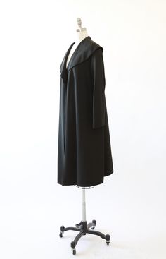 "Vintage 1940s black coat Stunning large draped collar Textured black satin fabric Fully lined opened front + single inner pocket Excellent condition - made very well M e a s u r e m e n t s: ------------------------------------------------------------------------------ Size: S M L depending on desired fit Bust: 26 1/2\" Waist: 28\" Hips: 31\" (open) Total Length: 45\" Sleeves: 27\" (from neck) Label: N/A -------------------------------------------------------------------------------- +All Measu Classic Solid Party Outerwear, Classic Party Outerwear, Classic Solid Color Party Outerwear, Classic Shawl Collar Outerwear For Evening, Classic Evening Outerwear With Shawl Collar, Black Open Front Formal Outerwear, Formal Black Open Front Outerwear, Formal Winter Outerwear With Open Front, Formal Open Front Outerwear For Winter