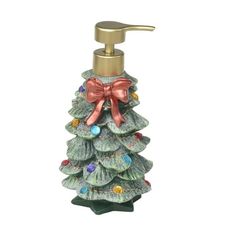 a christmas tree shaped soap dispenser with a red bow on the top