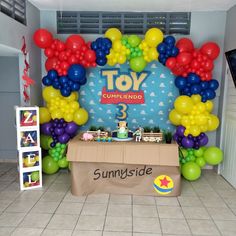 a toy story birthday party with balloons and decorations