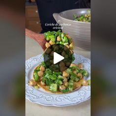 a white plate topped with beans and broccoli